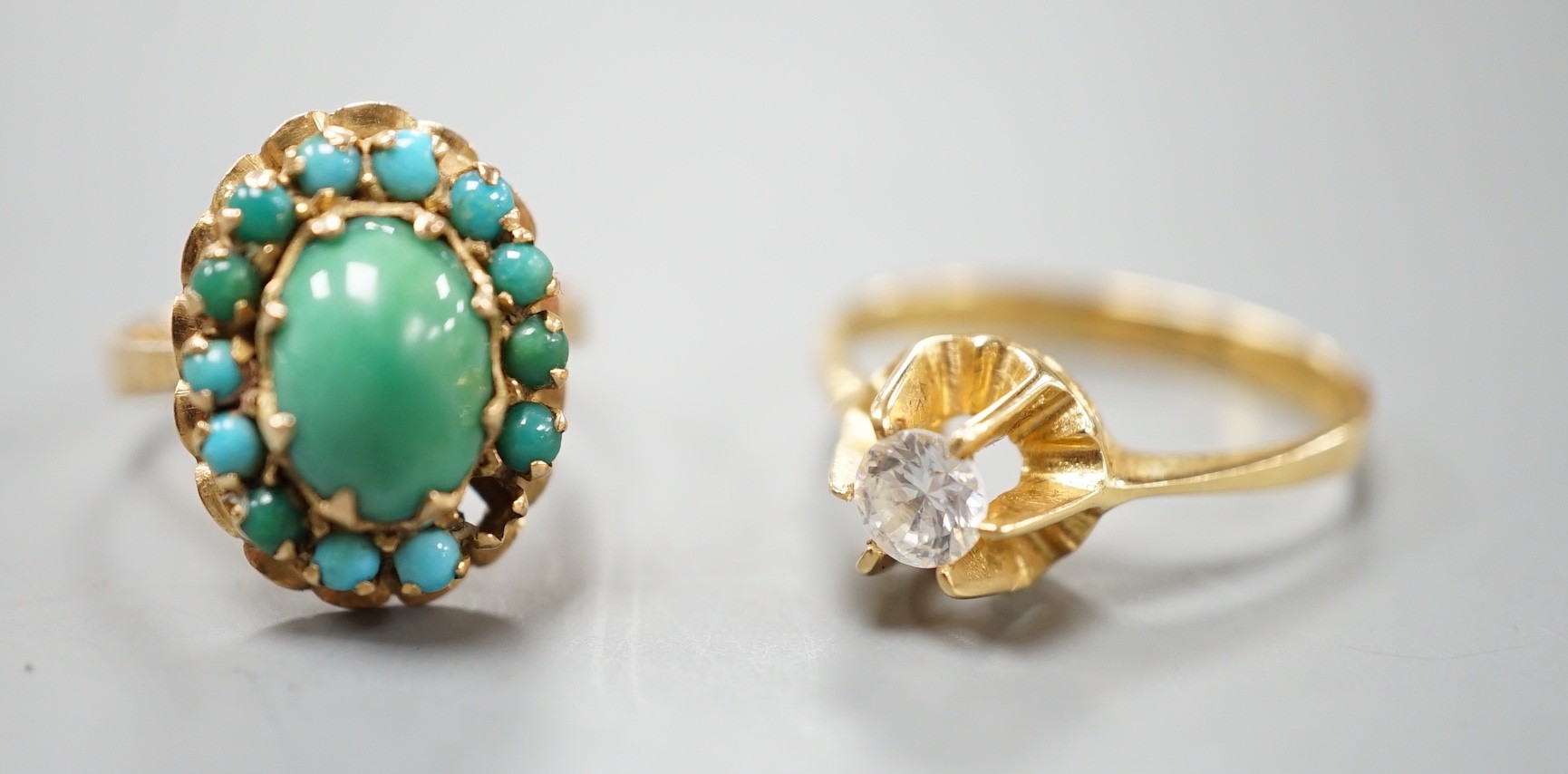 Two 750 yellow metal and gem set rings, turquoise cluster and simulated diamond, gross weight 7.4 grams, (stone missing).
